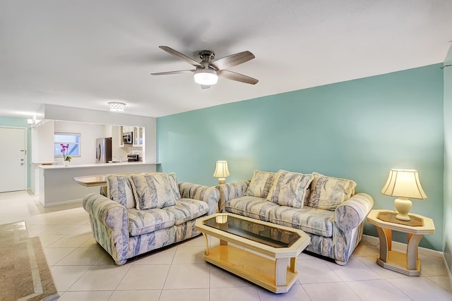 living room featuring ceiling fan and light tile patterned flooring