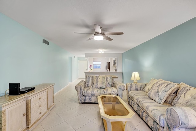 living room with light tile patterned floors and ceiling fan