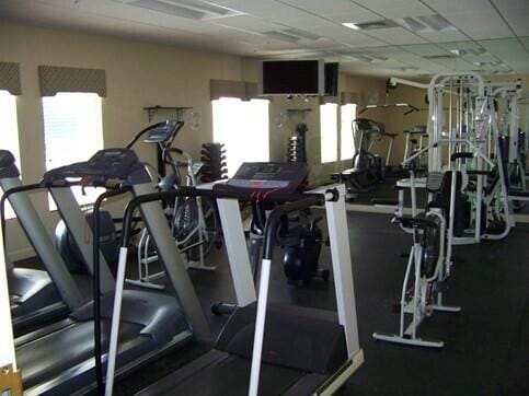 gym featuring a paneled ceiling