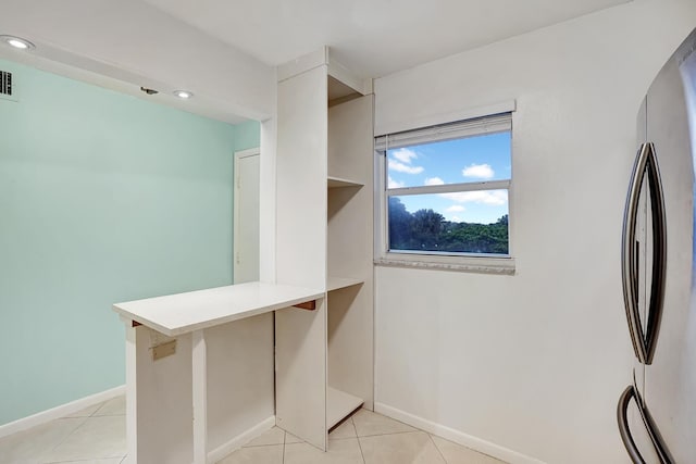 walk in closet featuring light tile patterned floors