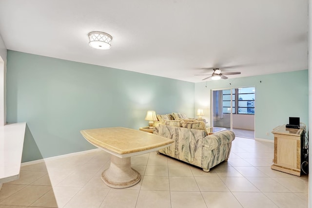 living room featuring ceiling fan and light tile patterned flooring