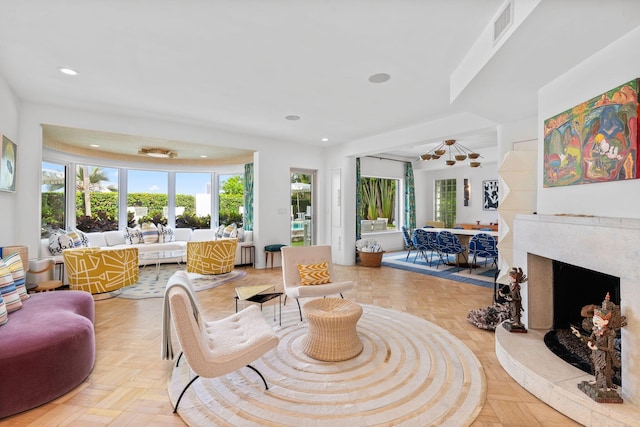 living room with light parquet flooring and a premium fireplace