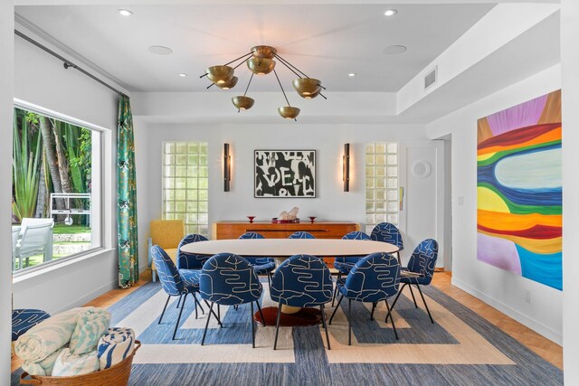 dining room featuring parquet floors and an inviting chandelier