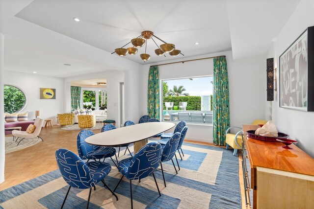 living room featuring beamed ceiling, hardwood / wood-style floors, and plenty of natural light