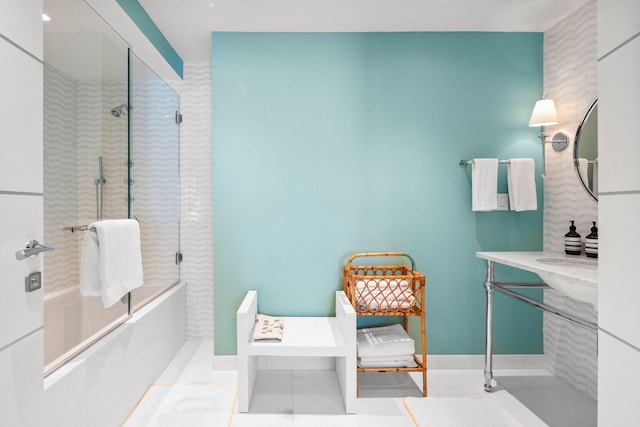 bathroom with tile floors and combined bath / shower with glass door