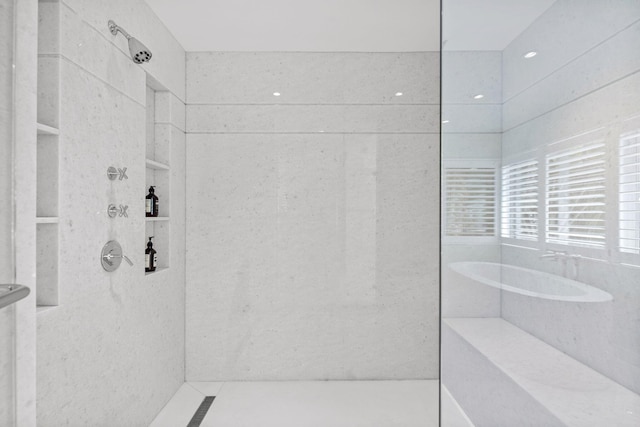 bathroom featuring separate shower and tub and tile floors