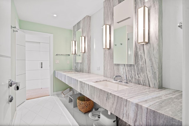 bathroom featuring tile patterned flooring and vanity