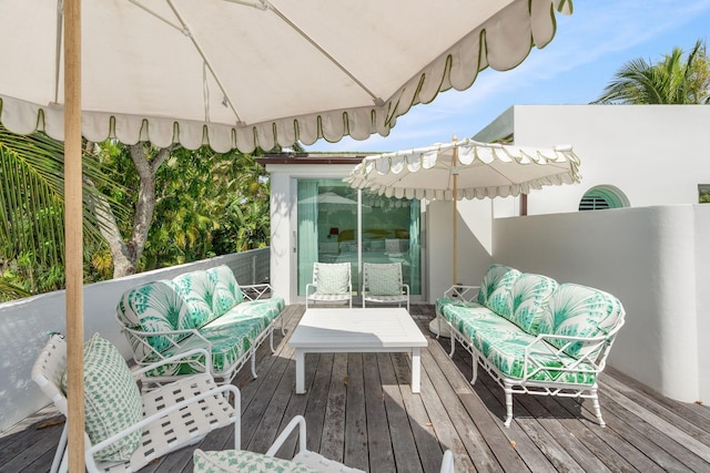 wooden deck featuring outdoor lounge area