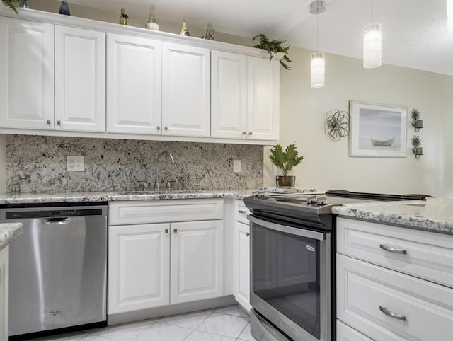 kitchen with pendant lighting, white cabinetry, sink, and appliances with stainless steel finishes