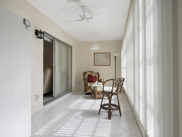 sunroom / solarium with ceiling fan