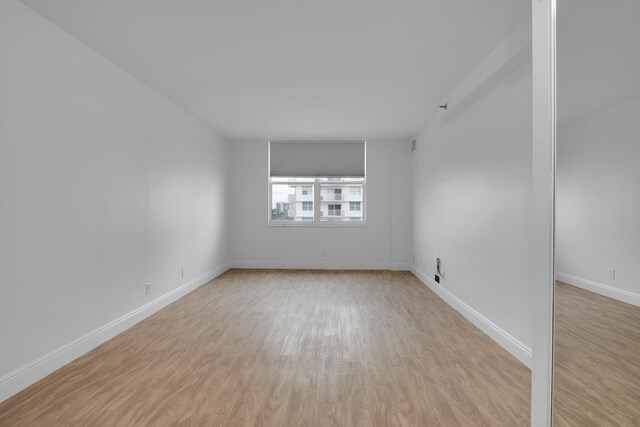 unfurnished room featuring light hardwood / wood-style flooring