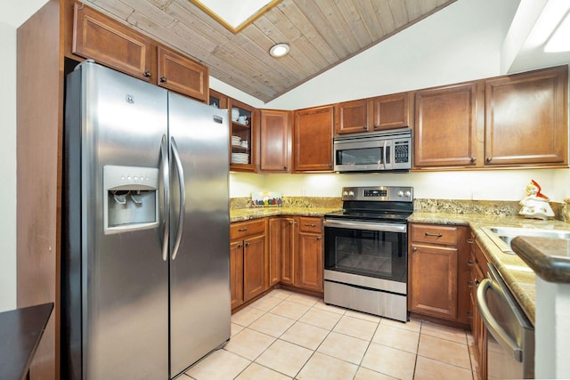 kitchen with sink, wooden ceiling, vaulted ceiling, light tile patterned floors, and appliances with stainless steel finishes