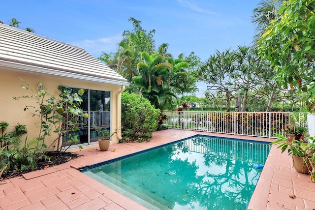 view of swimming pool with a patio