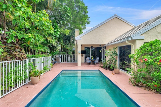 view of swimming pool with a patio area