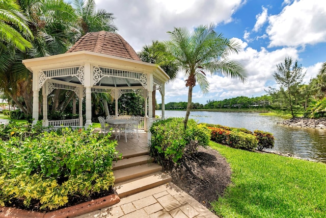 view of home's community with a gazebo and a water view