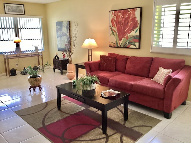 living room with plenty of natural light and light tile patterned flooring