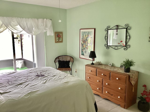 bedroom featuring light tile patterned flooring