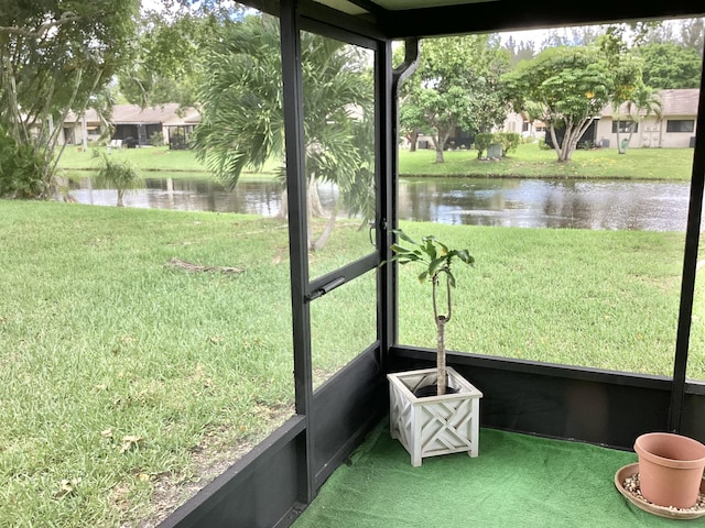 unfurnished sunroom with a water view and plenty of natural light