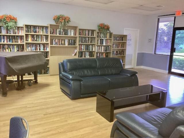 living area with light hardwood / wood-style flooring