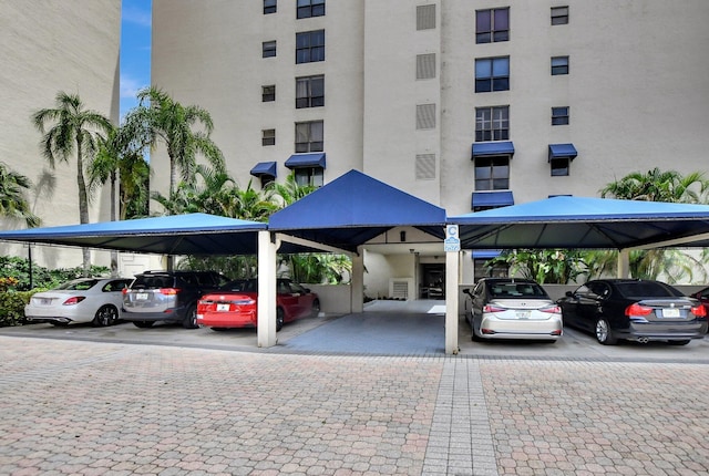 view of parking / parking lot featuring a carport