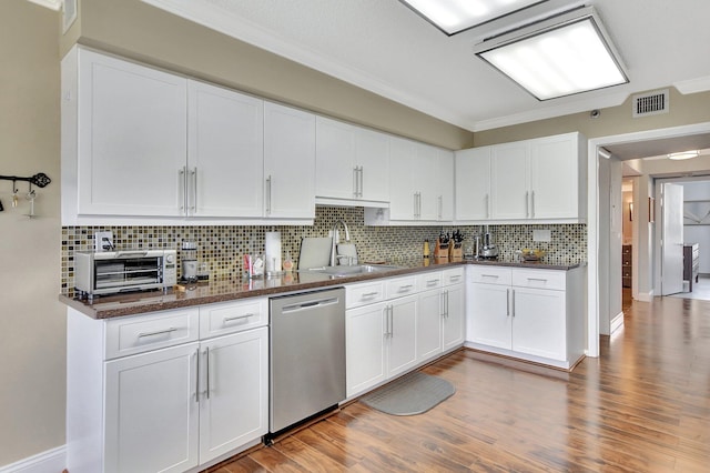 kitchen featuring white cabinetry, dishwasher, tasteful backsplash, and hardwood / wood-style floors