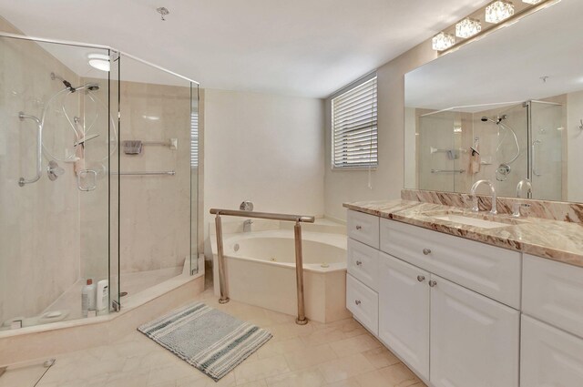 bathroom featuring tile patterned flooring, plus walk in shower, and vanity