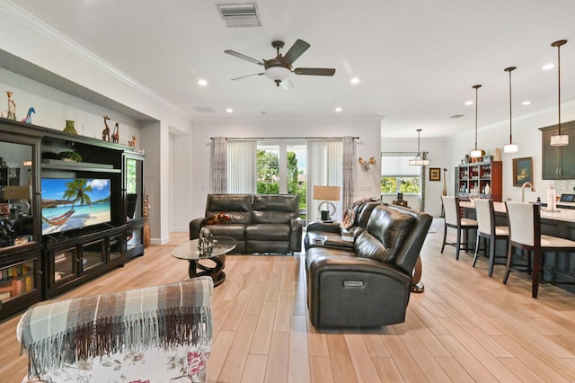 home office featuring wood-type flooring, ornamental molding, and ceiling fan