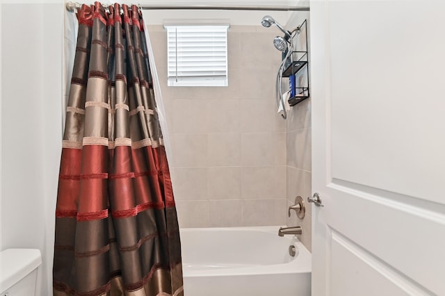 bathroom featuring shower / bathtub combination with curtain and toilet