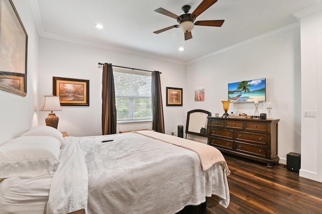 bedroom with ceiling fan, ornamental molding, and dark hardwood / wood-style floors