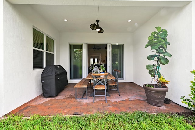 view of patio / terrace featuring ceiling fan and a grill