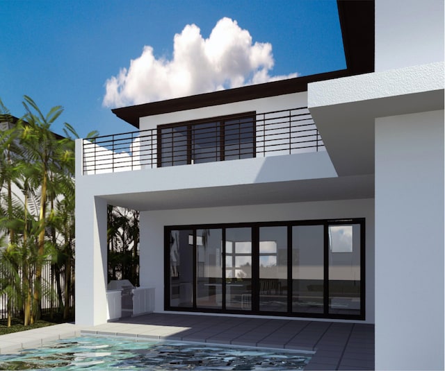 doorway to property featuring a balcony