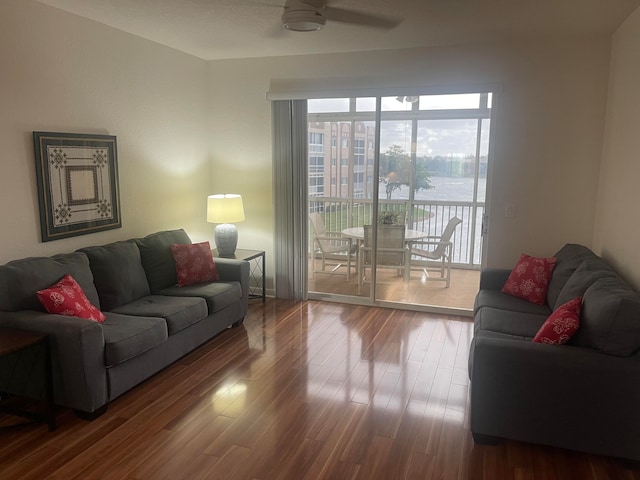 living room with hardwood / wood-style flooring and ceiling fan