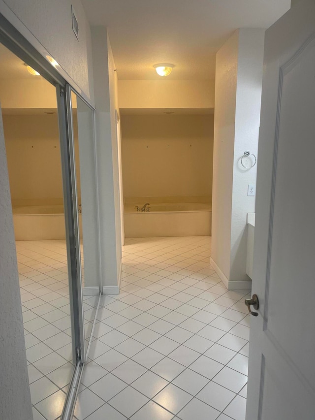 bathroom with plus walk in shower and tile patterned flooring