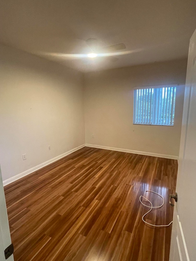 unfurnished room featuring dark hardwood / wood-style flooring