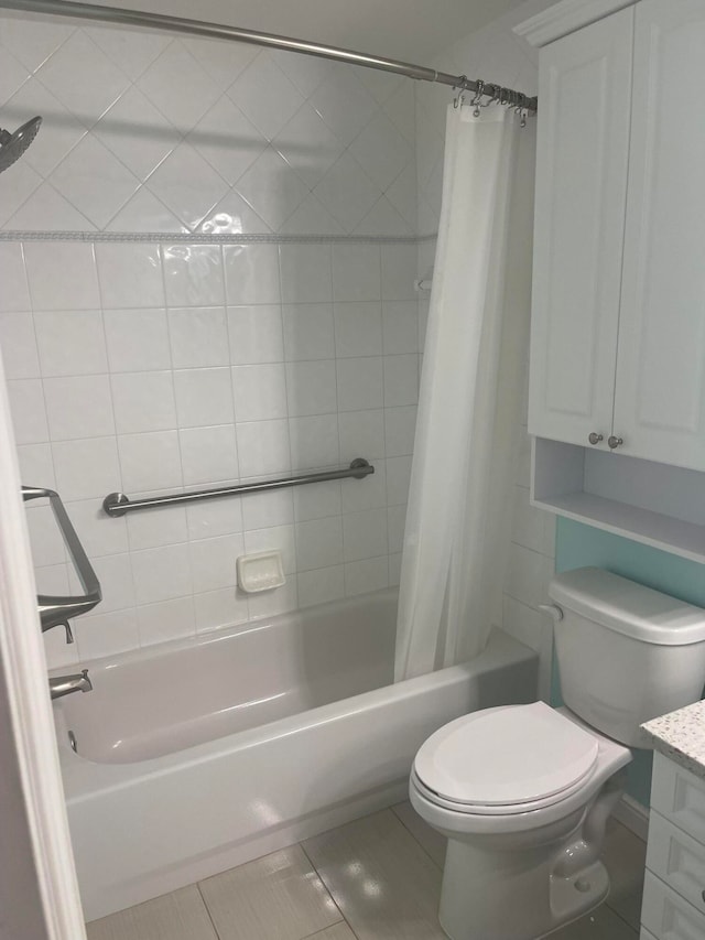 full bathroom featuring vanity, toilet, tile patterned floors, and shower / tub combo