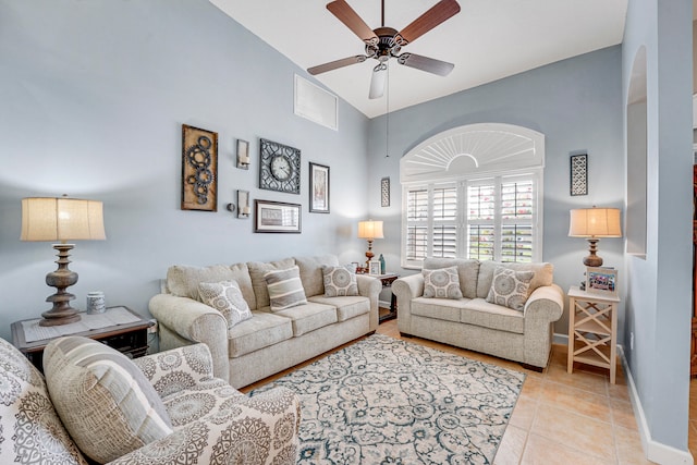 living room with high vaulted ceiling, tile flooring, and ceiling fan