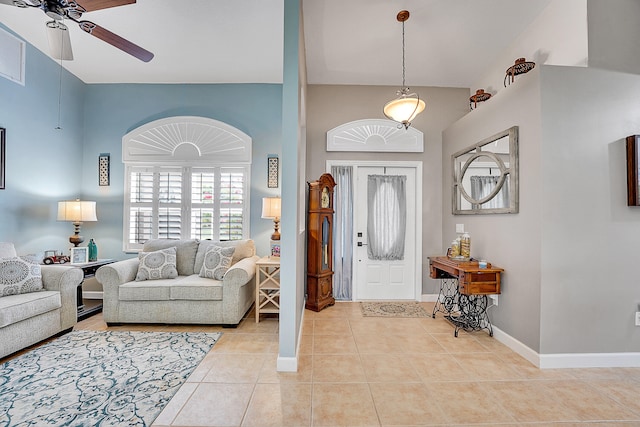 entryway with ceiling fan and light tile floors