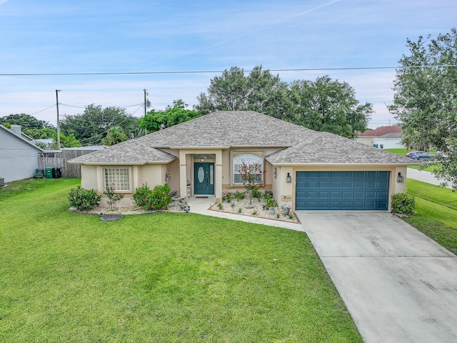 single story home featuring a garage and a front lawn