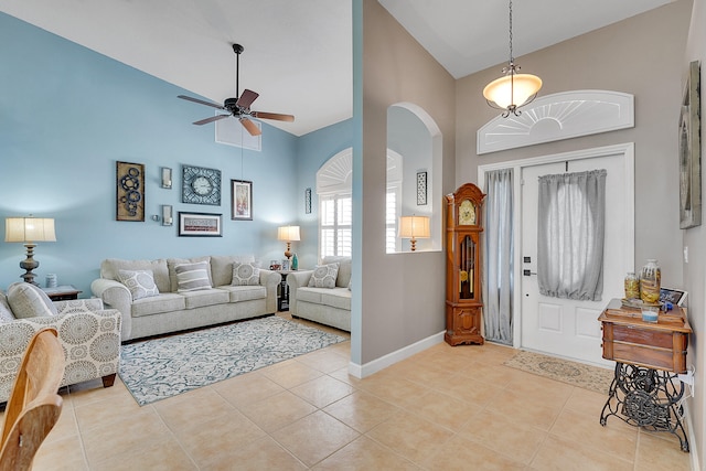 entrance foyer with high vaulted ceiling, ceiling fan, and light tile floors