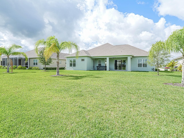 rear view of house with a lawn