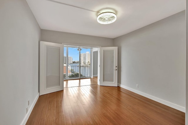 empty room featuring wood-type flooring