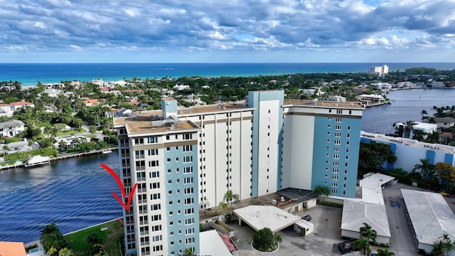 birds eye view of property featuring a water view