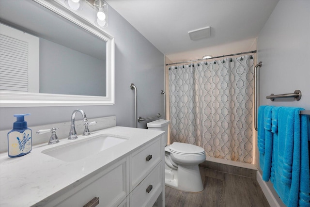 full bath featuring a shower with curtain, vanity, toilet, and wood finished floors