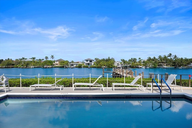 view of pool featuring a water view