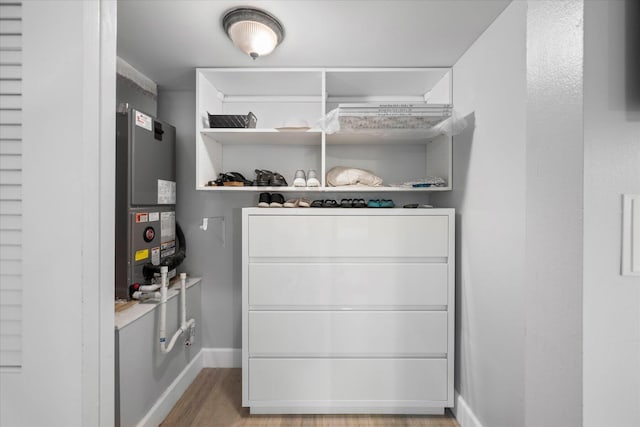 interior space with light wood-style floors and heating unit