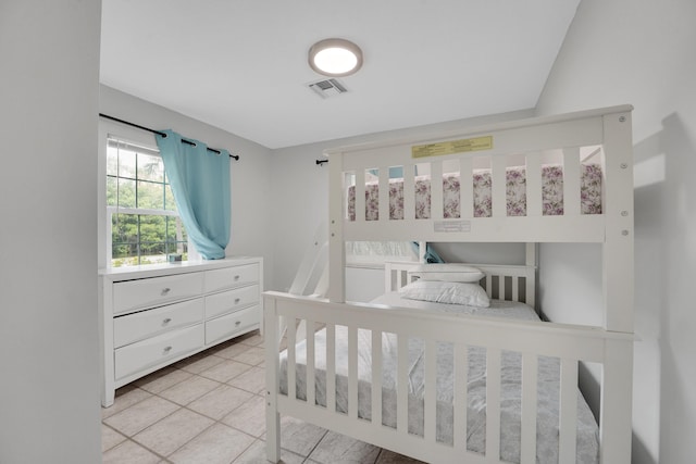 bedroom with light tile patterned floors