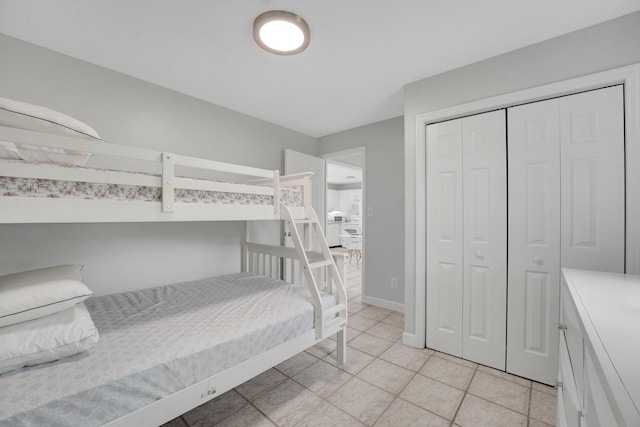 tiled bedroom featuring a closet