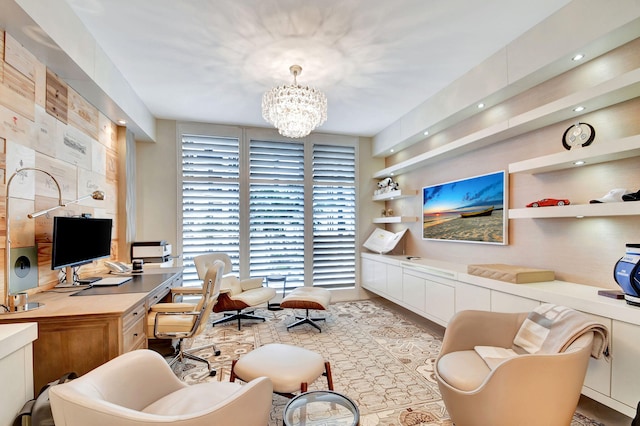 office area with an inviting chandelier