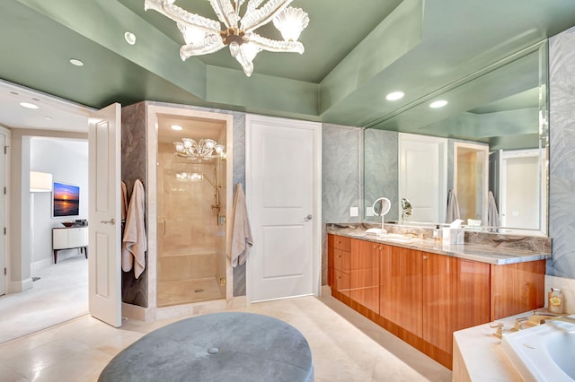 bathroom with separate shower and tub, tile patterned floors, vanity, and an inviting chandelier