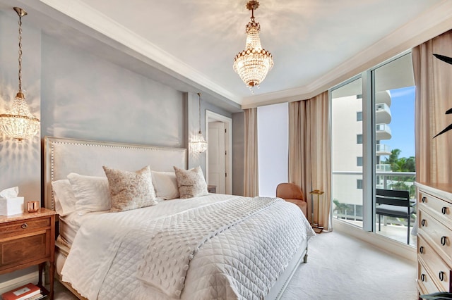 carpeted bedroom featuring a notable chandelier, access to exterior, and crown molding